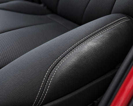 Detailing1 result — the seam separates clean, satin-matt BMW leather from the still greasy panel next to it