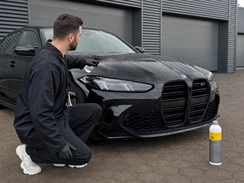 Daniel from Detailing1 checks the water bead test on a bonnet before using Koch-Chemie Reactivation Shampoo